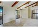 Dining area with exposed beams and sliding glass door to screened lanai at 1886 Elkcam Blvd, Deltona, FL 32725