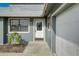 Charming single-story home featuring a decorative front door and attached two-car garage at 1886 Elkcam Blvd, Deltona, FL 32725