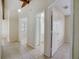 Hallway with neutral tile connects rooms and bathrooms in this bright home at 1886 Elkcam Blvd, Deltona, FL 32725