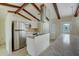 Kitchen boasts stainless steel appliances and white cabinetry at 1886 Elkcam Blvd, Deltona, FL 32725