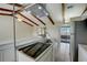 Bright kitchen with stainless steel appliances, white cabinets, and a kitchen island with breakfast bar seating at 1886 Elkcam Blvd, Deltona, FL 32725