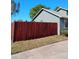 Shot of a home's green exterior paint, bright trim, and mature landscaping at 1886 Elkcam Blvd, Deltona, FL 32725