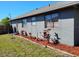 View of the home's exterior paint, new mulch, and healthy foliage at 1886 Elkcam Blvd, Deltona, FL 32725