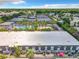 Expansive aerial view of a residential neighborhood featuring townhouses and a community pool at 1928 Conway Rd # 27, Orlando, FL 32812