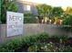 Metro at Michigan Park community sign surrounded by lush landscaping and mature palm trees at 1928 Conway Rd # 27, Orlando, FL 32812