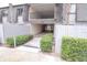 Inviting building exterior featuring covered parking, lush greenery, and well-maintained landscaping at 1928 Conway Rd # 27, Orlando, FL 32812