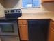 Well-equipped kitchen with updated stainless steel oven and dishwasher, perfect for cooking enthusiasts at 1928 Conway Rd # 27, Orlando, FL 32812