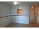 Bright living room with pass-through window and neutral walls offers an inviting space at 1928 Conway Rd # 27, Orlando, FL 32812