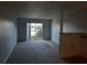 Cozy living room featuring sliding glass doors to the exterior and plush carpeting for ultimate comfort at 1928 Conway Rd # 40, Orlando, FL 32812