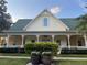 Charming community clubhouse with a welcoming front porch at 211 Longview Ave # 306, Kissimmee, FL 34747