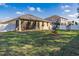 Fenced backyard with small trees and grassy area at 2147 Sunbow Ave, Apopka, FL 32703