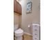 Small bathroom with toilet and cabinet for storage at 2147 Sunbow Ave, Apopka, FL 32703