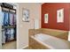 Relaxing bathroom with garden tub and walk-in closet at 2147 Sunbow Ave, Apopka, FL 32703