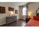 Bedroom with dresser and a queen-size bed at 2147 Sunbow Ave, Apopka, FL 32703