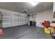 Garage with diamond plate flooring and storage at 2147 Sunbow Ave, Apopka, FL 32703