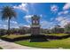 Community guard house with landscaping and palm trees at 2147 Sunbow Ave, Apopka, FL 32703