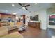 Open living space with sectional sofa and hardwood floors at 2147 Sunbow Ave, Apopka, FL 32703