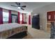 Main bedroom features king-size bed and access to bathroom at 2147 Sunbow Ave, Apopka, FL 32703