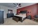 Main bedroom with king-size bed and dark wood furniture at 2147 Sunbow Ave, Apopka, FL 32703