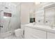 Elegant bathroom with marble shower, double vanity, and modern fixtures at 236 Acadia Ter, Celebration, FL 34747