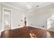 Bright bedroom featuring hardwood floors and access to another room at 236 Acadia Ter, Celebration, FL 34747