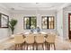 Bright dining room with large windows, a statement light fixture, and a tiled floor at 236 Acadia Ter, Celebration, FL 34747