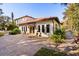 Charming home exterior with a red tile roof and a brick paved driveway at 236 Acadia Ter, Celebration, FL 34747