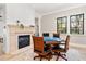 Game room with fireplace, poker table, and large windows offering natural light at 236 Acadia Ter, Celebration, FL 34747