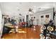 Well-equipped home gym with various exercise machines and weights at 236 Acadia Ter, Celebration, FL 34747