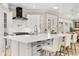 Bright kitchen features a large center island, white cabinets and luxury appliances at 236 Acadia Ter, Celebration, FL 34747