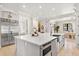 Open kitchen with a large island, stainless steel appliances, and modern finishes at 236 Acadia Ter, Celebration, FL 34747