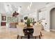Open-concept with dining area featuring tile floors, tray ceilings, and neutral decor at 236 Acadia Ter, Celebration, FL 34747