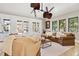 Living room features neutral decor, tile floors, modern lighting, and natural light at 236 Acadia Ter, Celebration, FL 34747