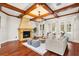 Bright living room with hardwood floors, fireplace, and access to backyard at 236 Acadia Ter, Celebration, FL 34747