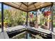Relaxing outdoor space featuring comfortable wicker seating and a serene koi pond view at 236 Acadia Ter, Celebration, FL 34747
