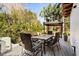 Outdoor patio with dining table and seating, perfect for enjoying meals in the beautiful backyard at 236 Acadia Ter, Celebration, FL 34747