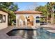 Beautiful pool featuring a cabana with a cooking area at 236 Acadia Ter, Celebration, FL 34747