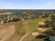 Vast aerial view of golf course and lake at 2513 Castle Pines St, Clermont, FL 34711