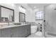 Modern bathroom with double vanity, soaking tub, and walk-in shower at 2513 Castle Pines St, Clermont, FL 34711