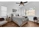 Bedroom with a large bed, ceiling fan, and plenty of natural light at 2513 Castle Pines St, Clermont, FL 34711