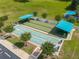 Aerial view of two bocce ball courts with shade structures at 2513 Castle Pines St, Clermont, FL 34711