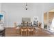 Bright dining room with a wooden table and chandelier at 2513 Castle Pines St, Clermont, FL 34711