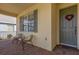Inviting front porch with seating area and brick flooring at 2513 Castle Pines St, Clermont, FL 34711