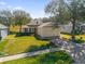 Single-story house with attached garage and manicured lawn at 2513 Castle Pines St, Clermont, FL 34711
