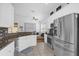 Modern kitchen with stainless steel appliances and granite countertops at 2513 Castle Pines St, Clermont, FL 34711