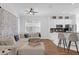 Living room with an L-shaped couch and kitchen views at 2513 Castle Pines St, Clermont, FL 34711