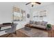 Home office featuring a desk, couch, and large windows at 2513 Castle Pines St, Clermont, FL 34711