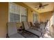 Relaxing screened porch with lounge chairs and dining area at 2513 Castle Pines St, Clermont, FL 34711