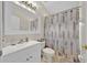 Bathroom with shower/tub combo and updated vanity at 2627 Oneida Loop, Kissimmee, FL 34747