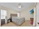 Spacious bedroom with a bed and window at 2627 Oneida Loop, Kissimmee, FL 34747